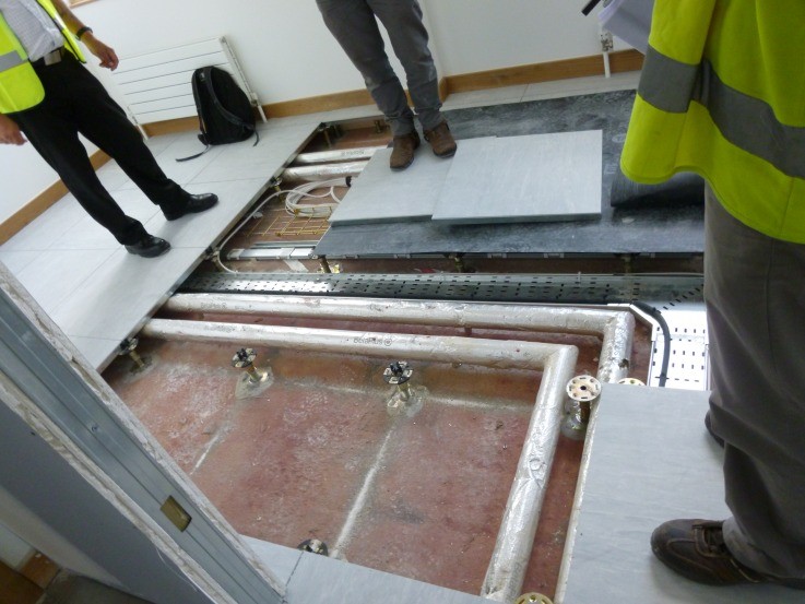 Ah. Heating and water pipework has already been routed through the space we allocated on drawings for the comms room