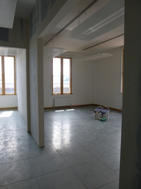 The would-be boardroom through the doorway on the right, about to be painted