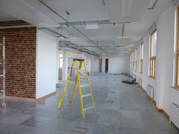 Brick cladding fitted as a feature on the open-plan floor space