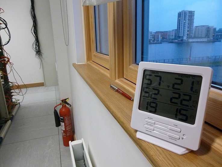 Day-one environmental monitoring: a hygrometer on the window sill, dockside through the window