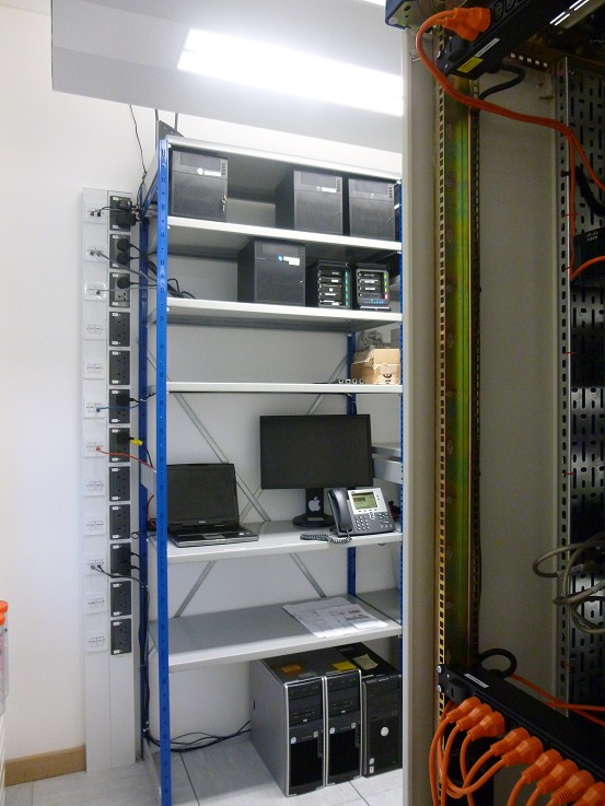 Steel shelving for spares and equipment better suited to shelves than 19" cabinets, complete with the obligatory Cisco VoIP handset